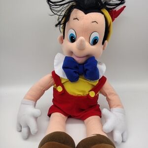 Vintage Mattel Plush Pinocchio Stuffed Toy with Red Overalls and Blue Bow 1992